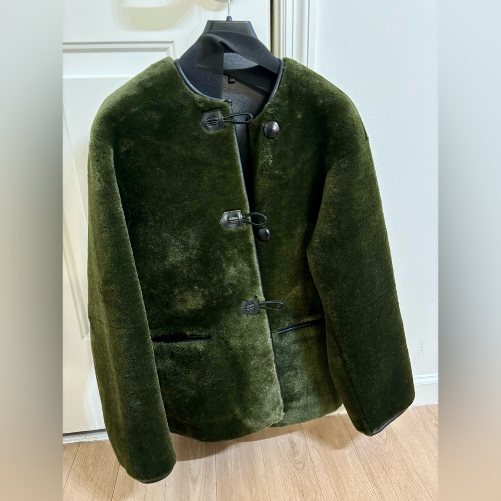 Mango Fur-effect coat with appliqués.